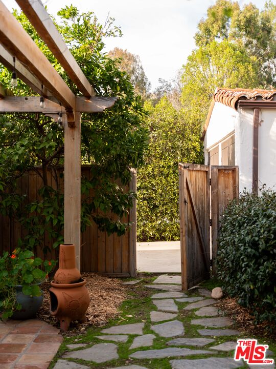 1200 Avenue 64 Pasadena, CA 91105 - Photo 49 of 62 a front view of a house with garden