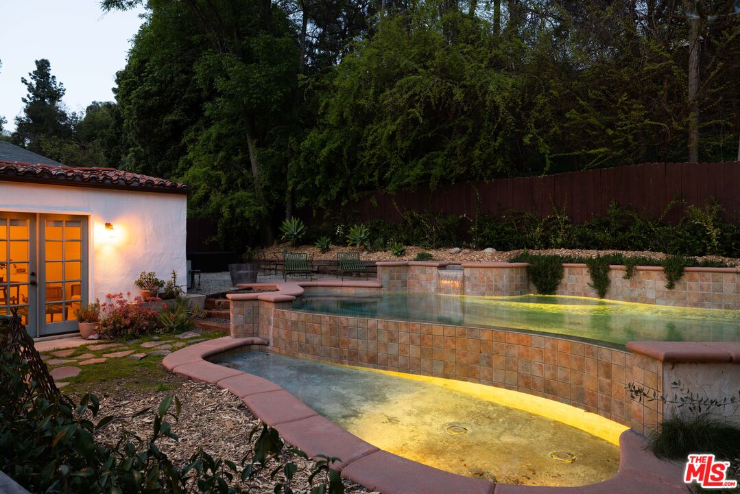 1200 Avenue 64 Pasadena, CA 91105 - Photo 56 of 62 a view of a swimming pool with a patio