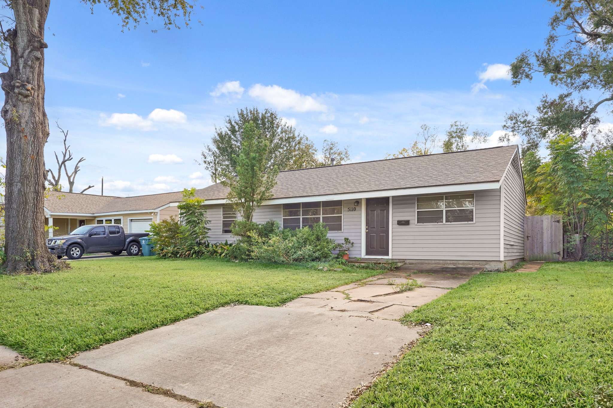 5110 Perry Street Houston, TX 77021 - Photo 2 of 15 a front view of a house with a garden and yard