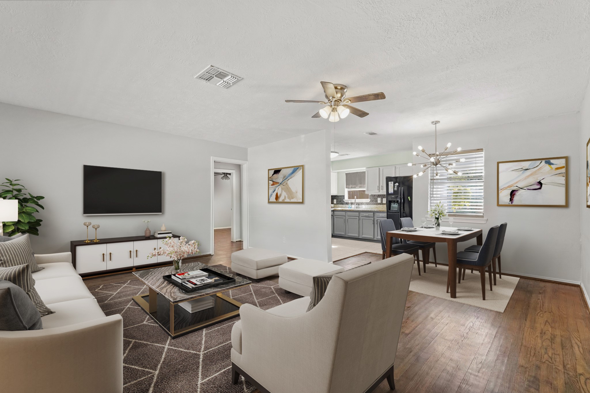 5110 Perry Street Houston, TX 77021 - Photo 3 of 15 a living room with furniture a wooden floor and a flat screen tv