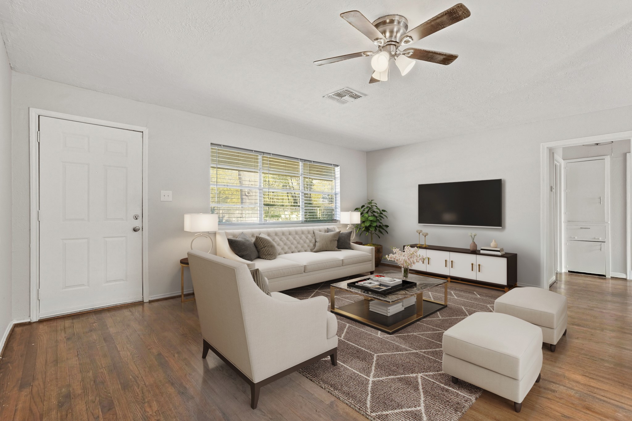 5110 Perry Street Houston, TX 77021 - Photo 4 of 15 a living room with furniture and a flat screen tv