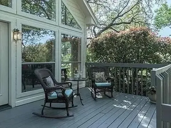 a view of two chairs in the balcony