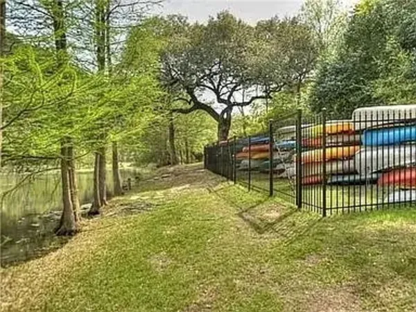 a kitchen with granite countertop a sink and a stove
