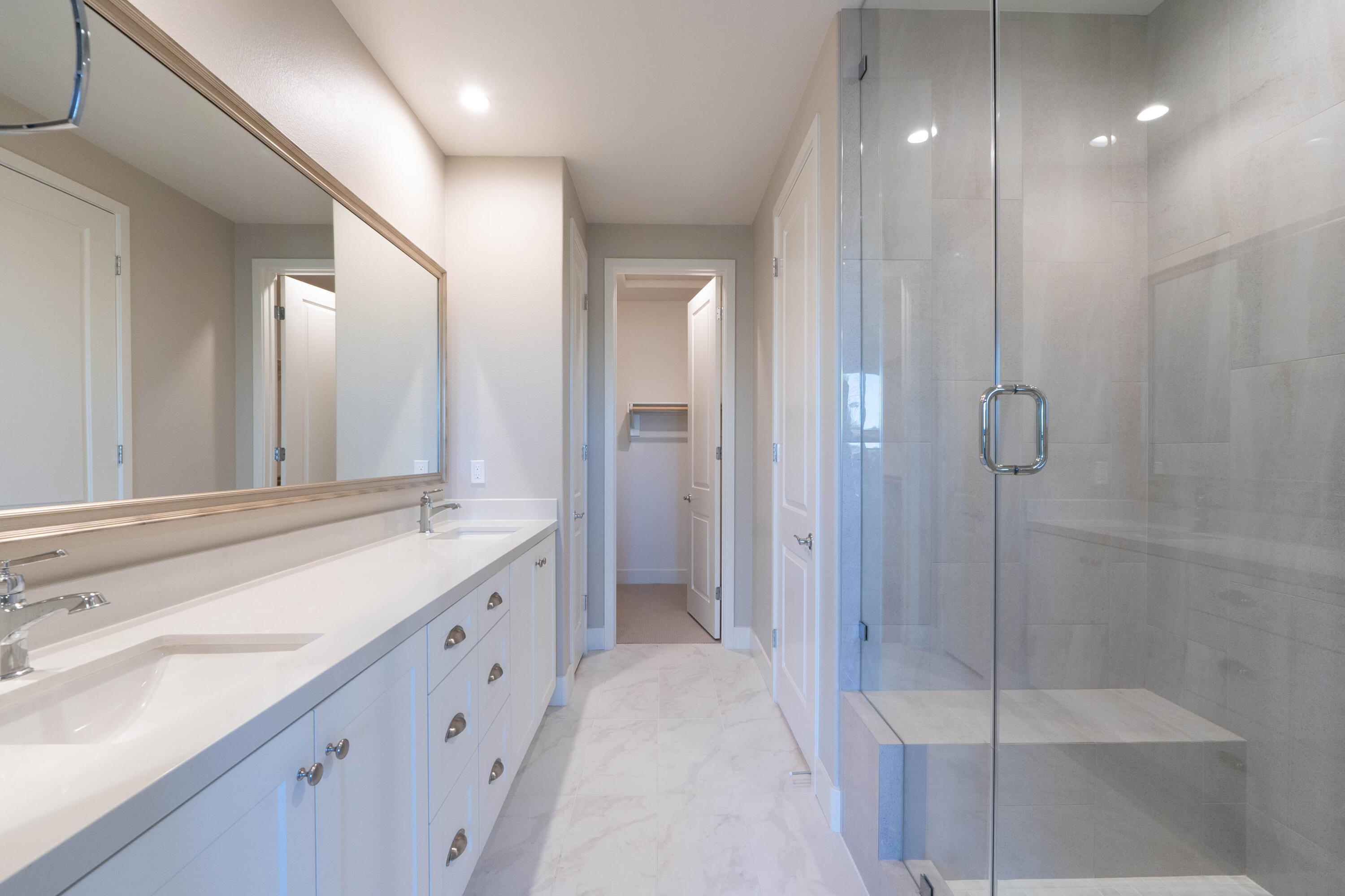 51502 Mastic Way Indio, CA 92201 - Photo 16 of 29 a spacious bathroom with a shower sink and mirror