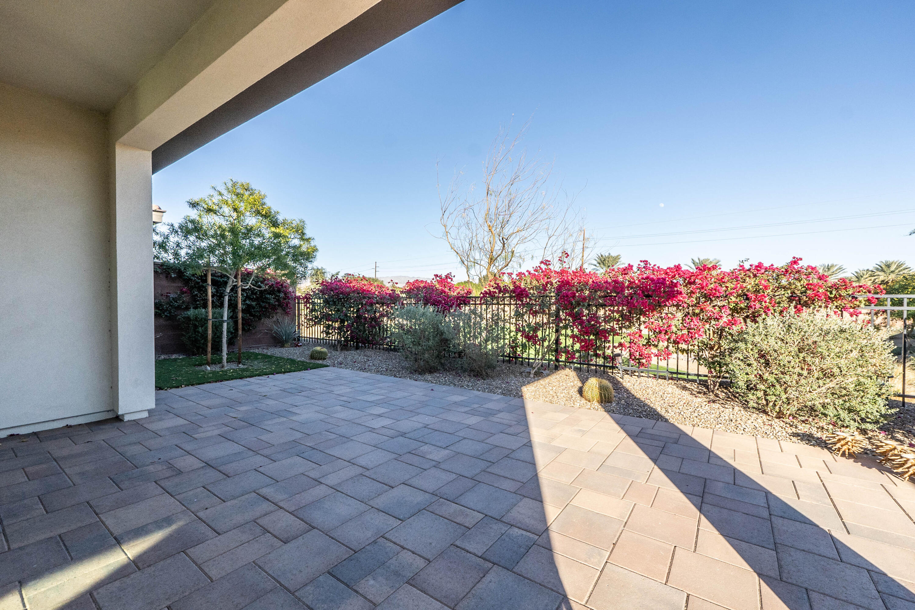 51502 Mastic Way Indio, CA 92201 - Photo 25 of 29 a view of a flower garden with a chair