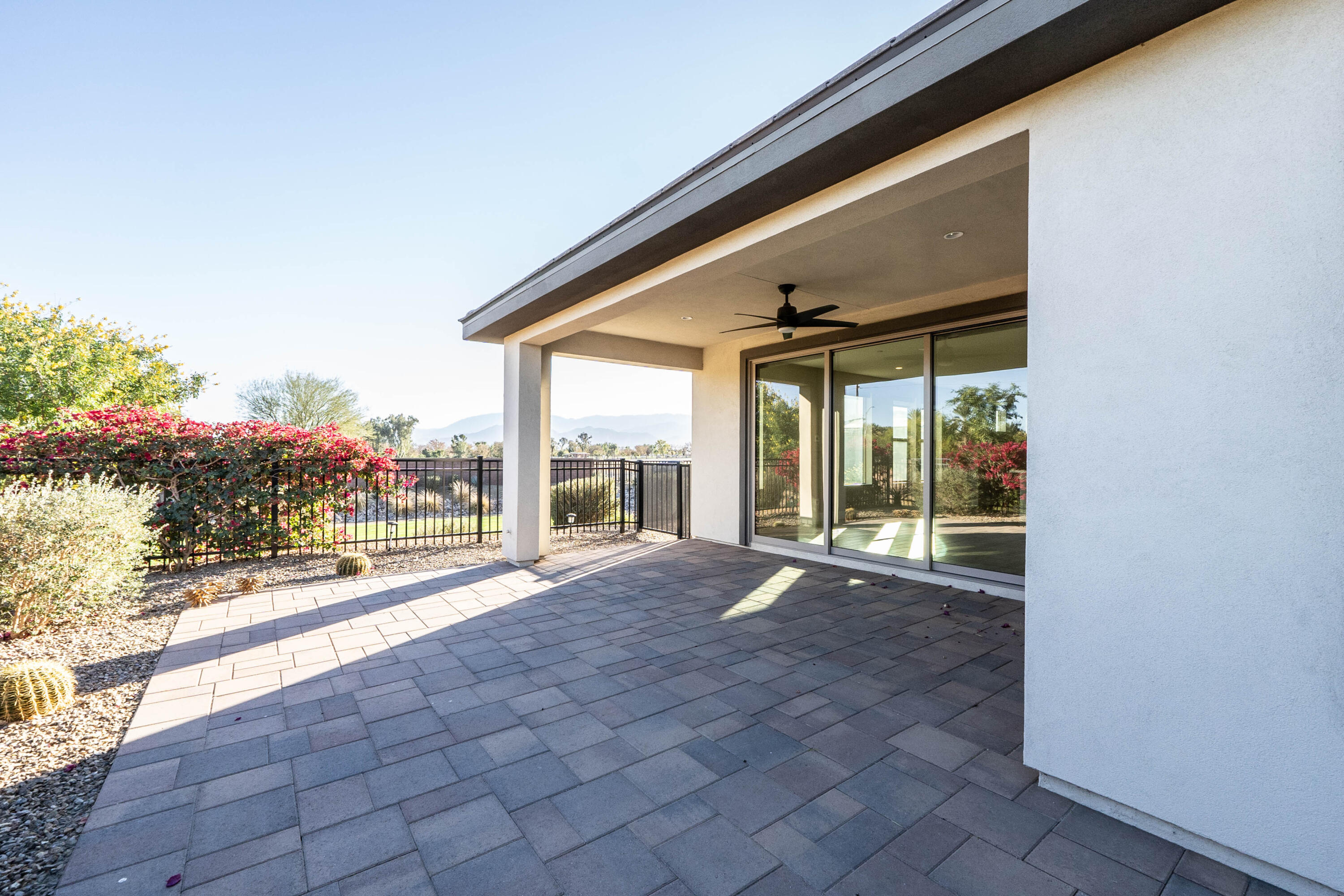 51502 Mastic Way Indio, CA 92201 - Photo 27 of 29 a view of an empty room with a floor to ceiling window and garden