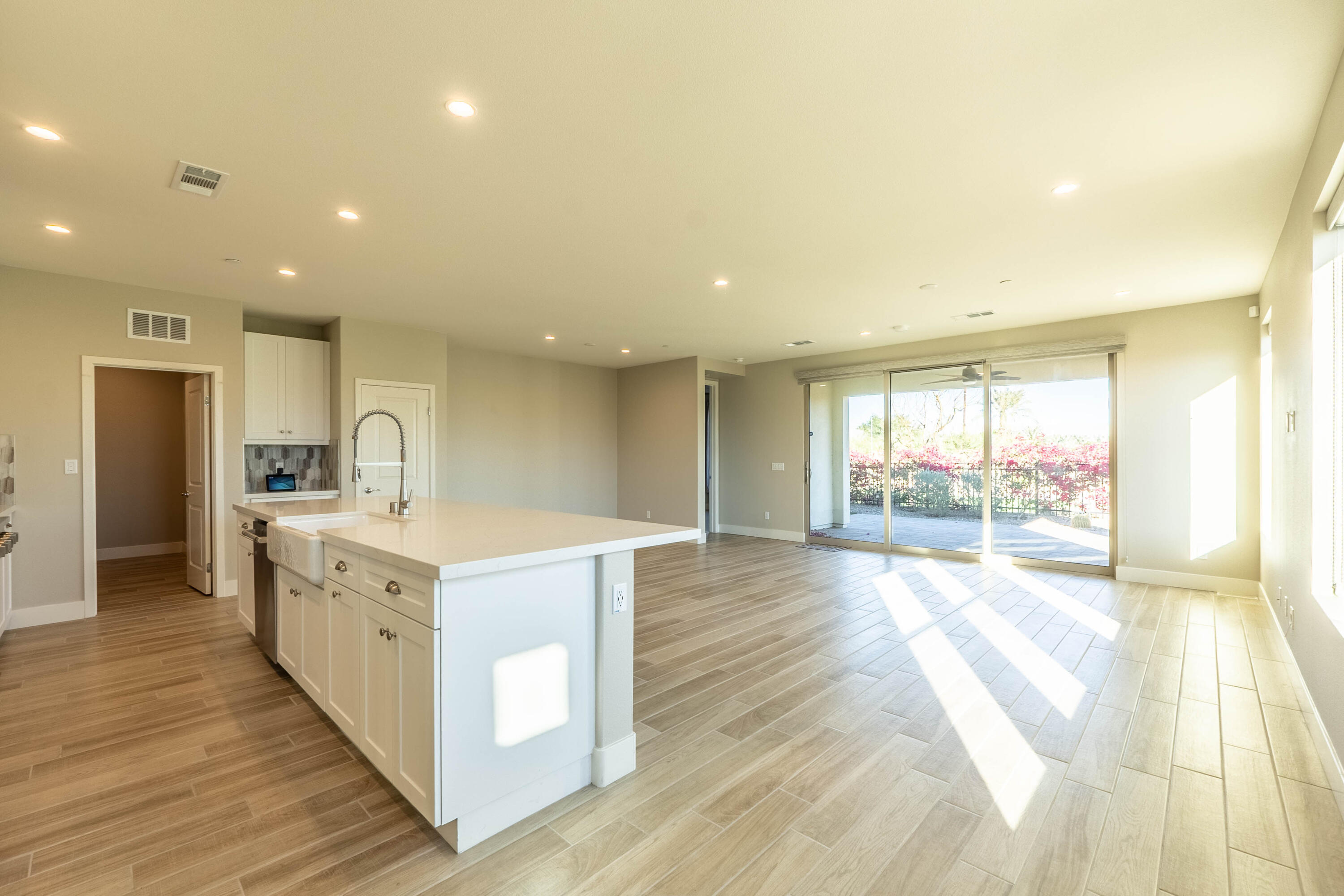 51502 Mastic Way Indio, CA 92201 - Photo 3 of 29 a large kitchen with stainless steel appliances a large counter top a stove and a refrigerator