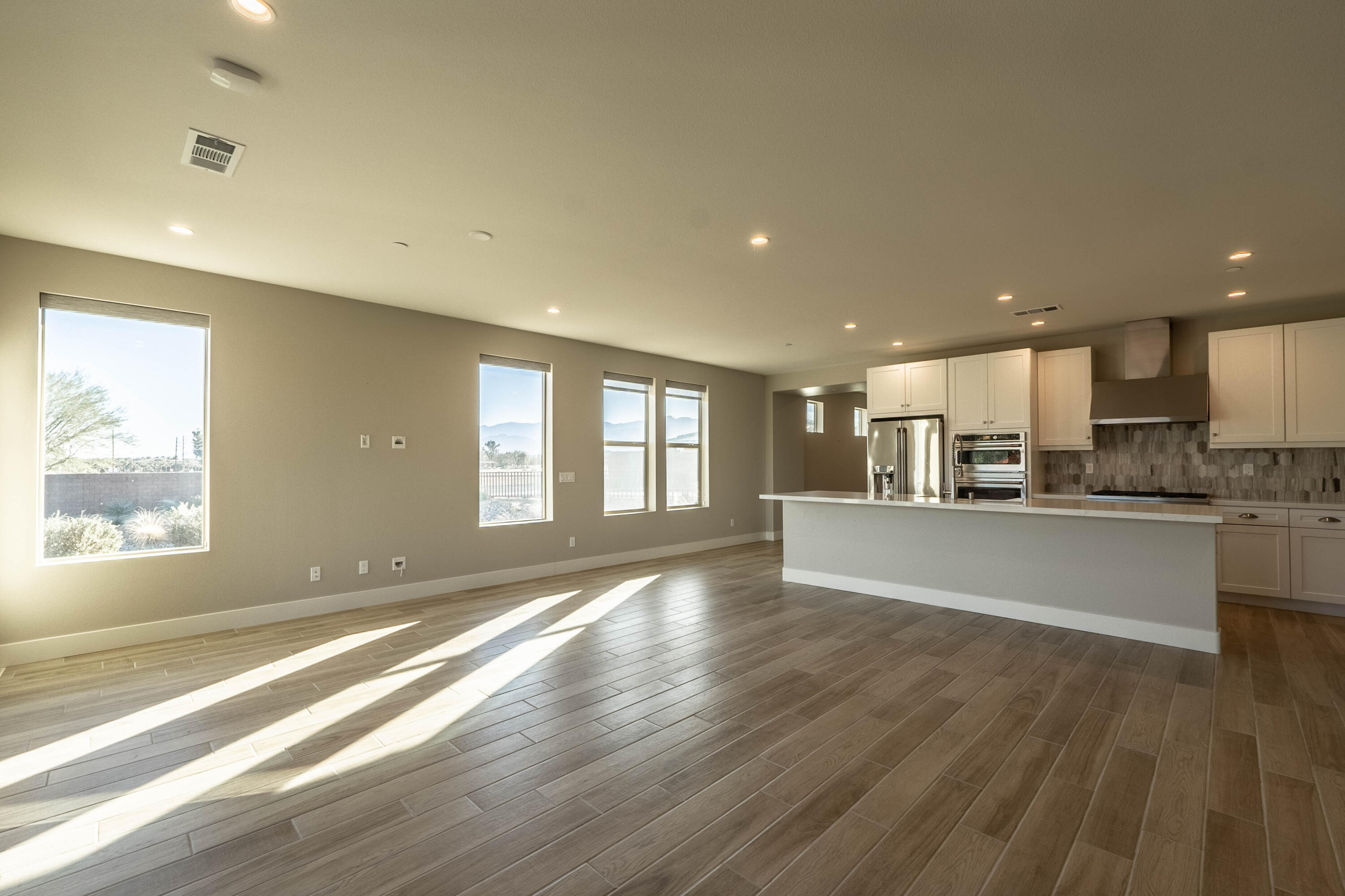 51502 Mastic Way Indio, CA 92201 - Photo 5 of 29 a view of large kitchen with a sink and wooden floor