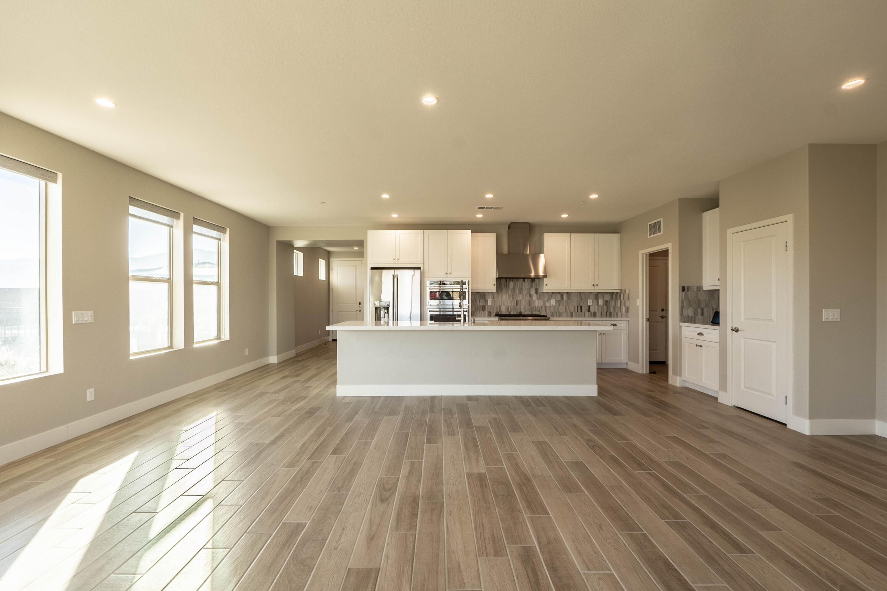 51502 Mastic Way Indio, CA 92201 - Photo 6 of 29 a big room with wooden floor and windows