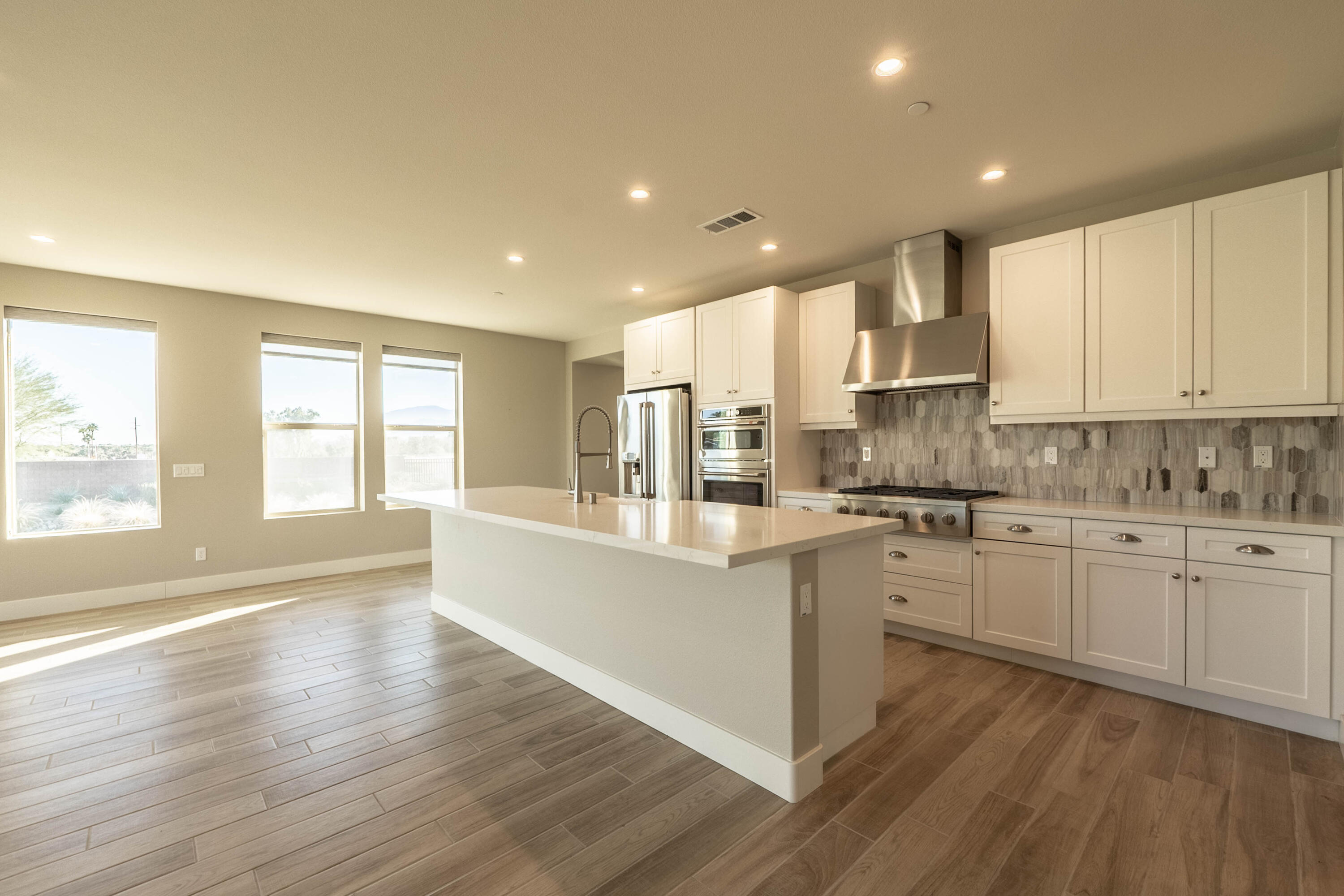 51502 Mastic Way Indio, CA 92201 - Photo 7 of 29 a large kitchen with granite countertop a large counter top space a sink stainless steel appliances and cabinets