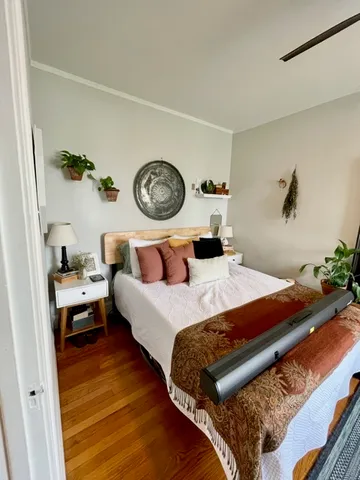 a bedroom with a bed and a table in it