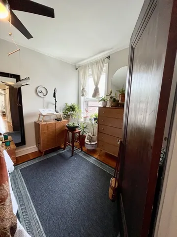 a room with a bed and a mirror