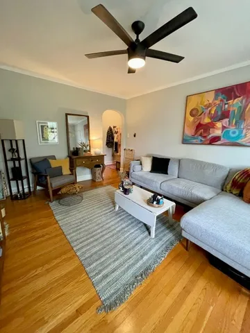 a living room with furniture and a rug