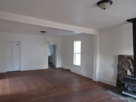 a view of livingroom with hardwood floor and window