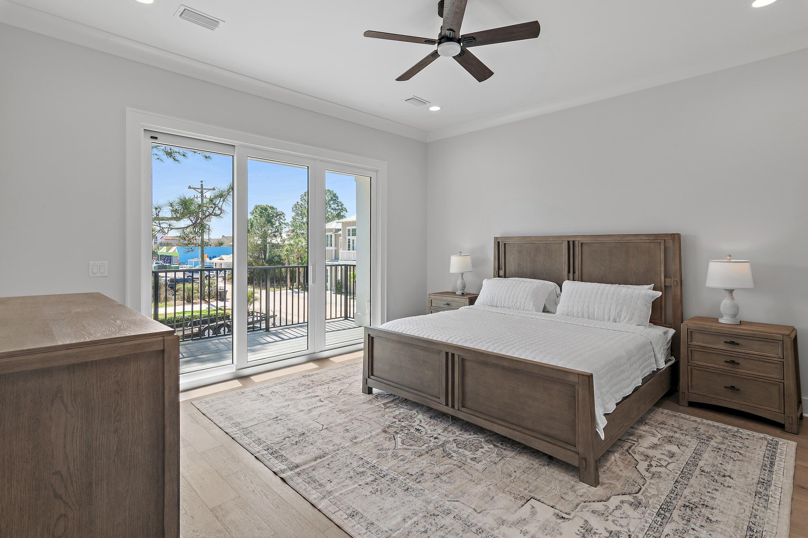 22 Henderson Place Santa Rosa Beach, FL 32459 - Photo 11 of 33 a spacious bedroom with a bed a couch and a large window