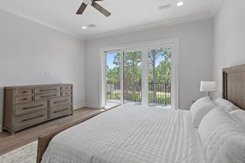 a bedroom with a large bed and a large window