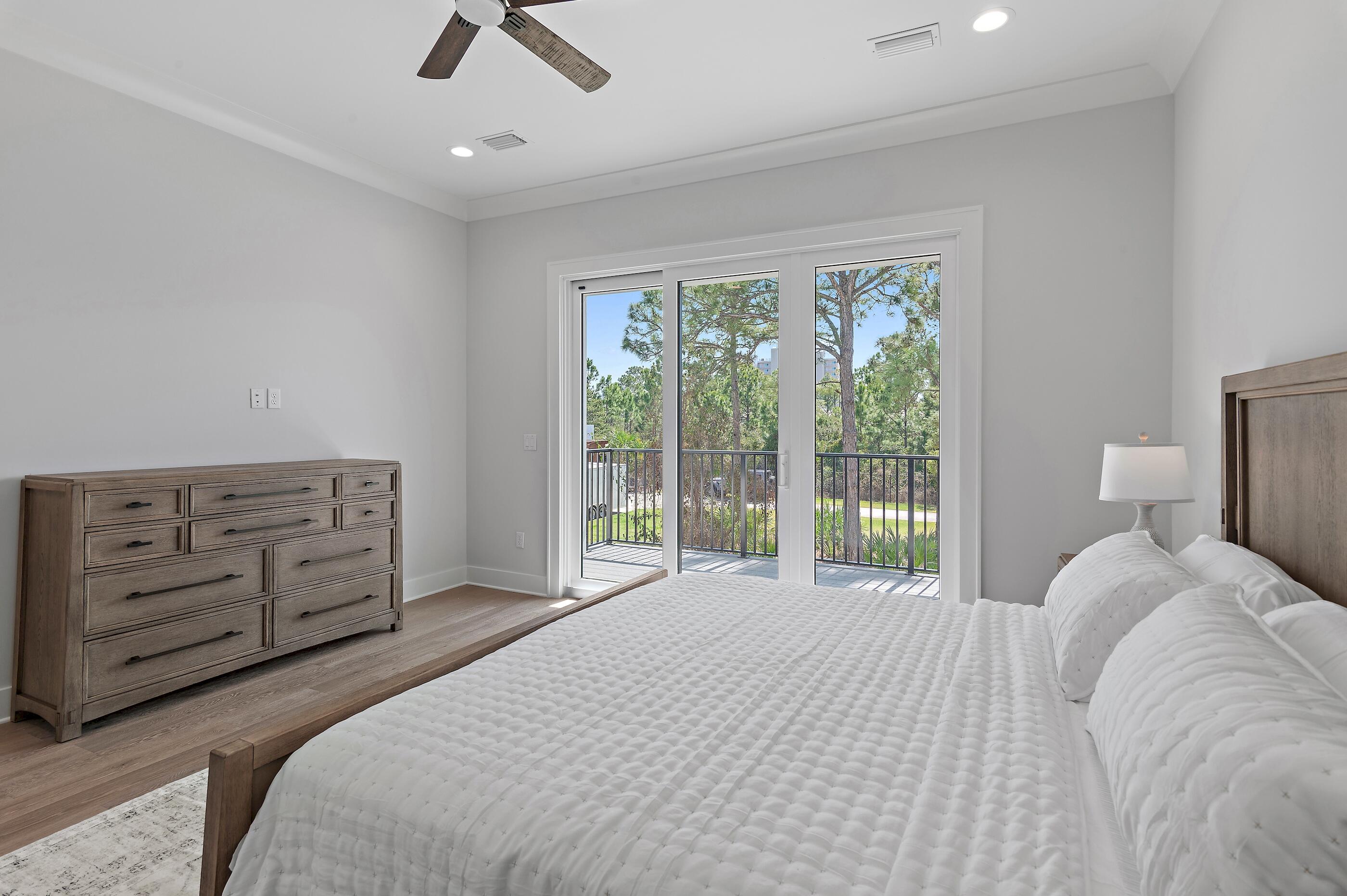 22 Henderson Place Santa Rosa Beach, FL 32459 - Photo 12 of 33 a bedroom with a large bed and a large window