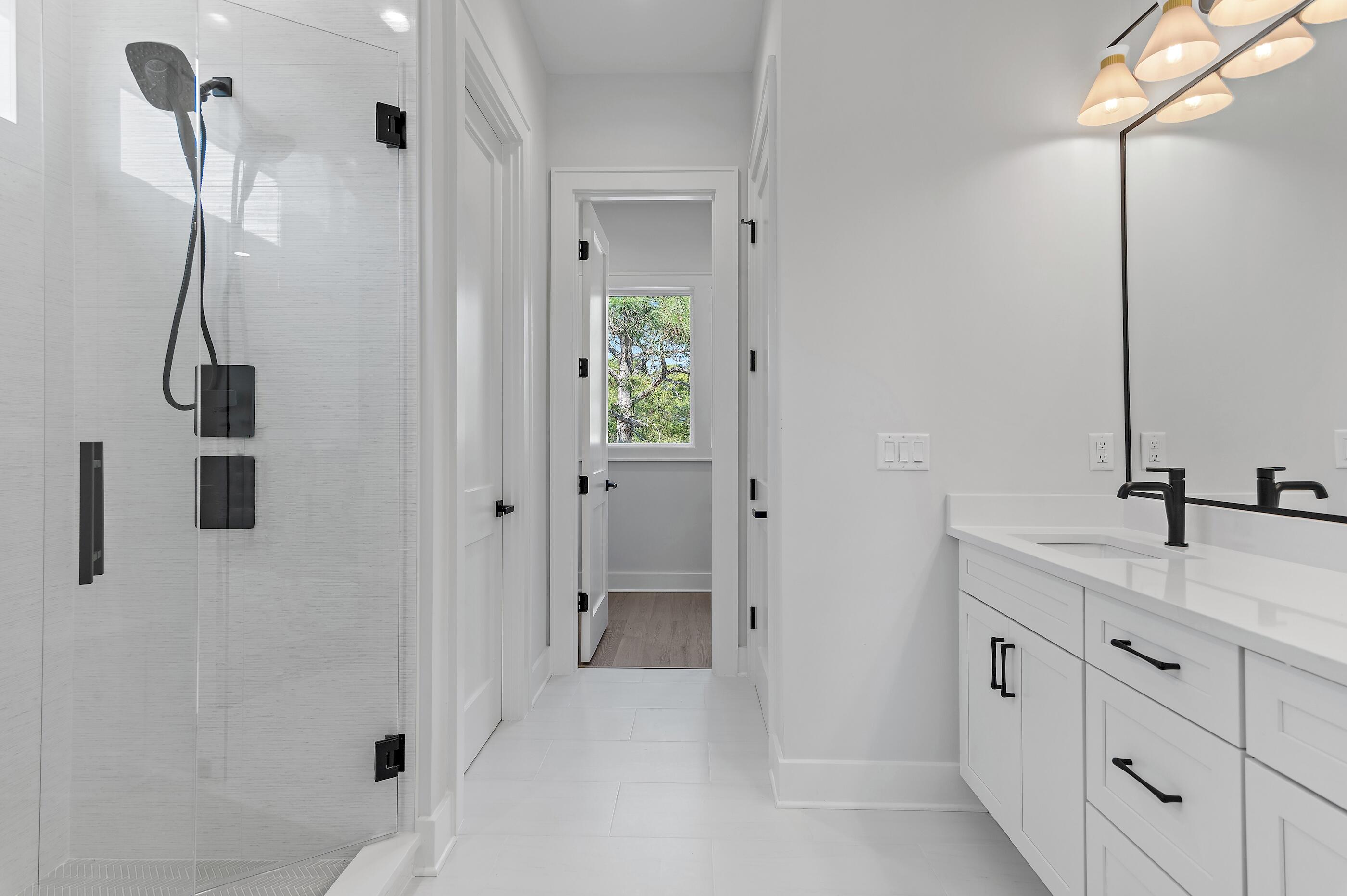 22 Henderson Place Santa Rosa Beach, FL 32459 - Photo 14 of 33 a bathroom with a double vanity sink a and a shower