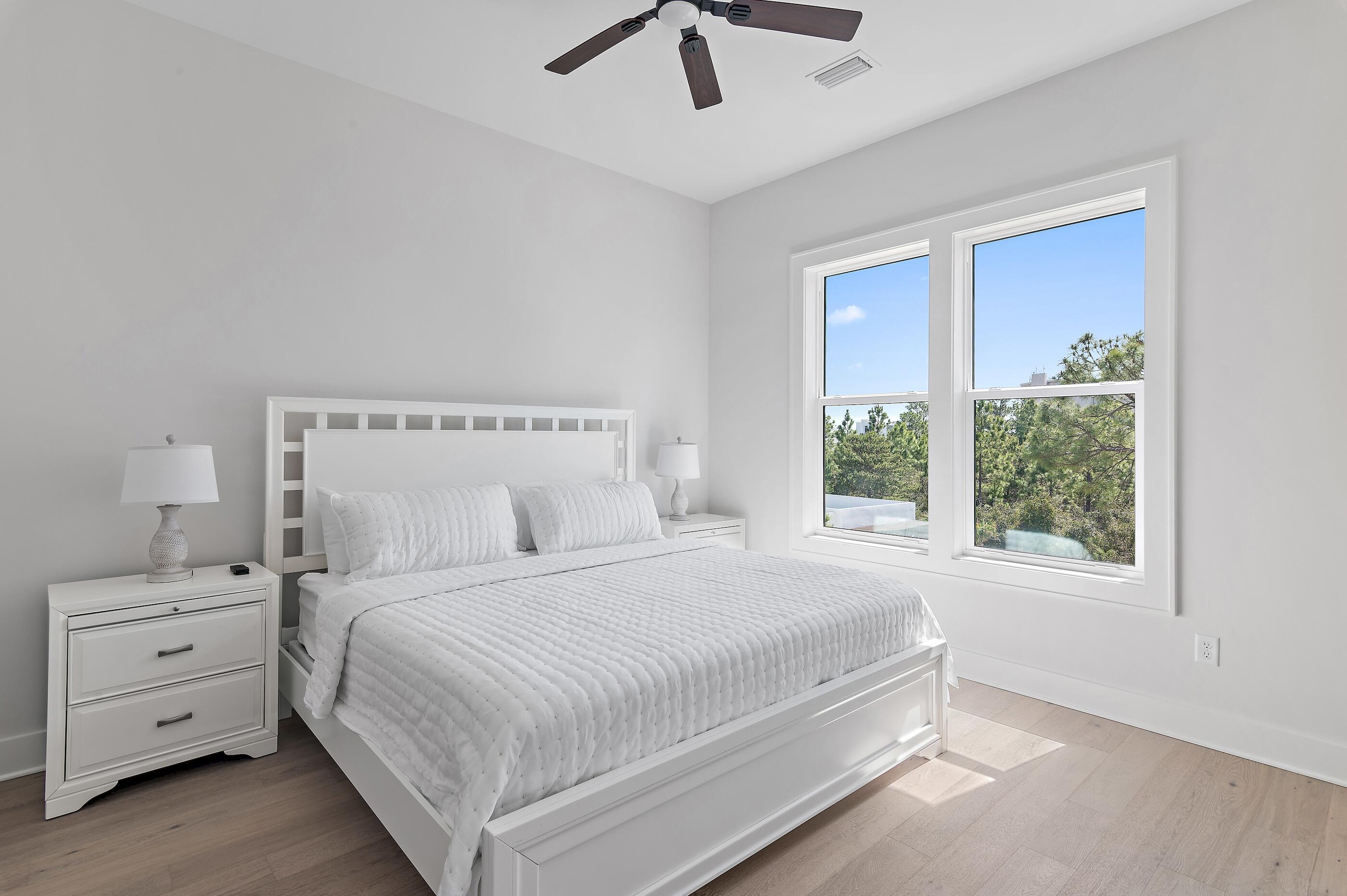 22 Henderson Place Santa Rosa Beach, FL 32459 - Photo 25 of 33 a bedroom with a large bed and a large window