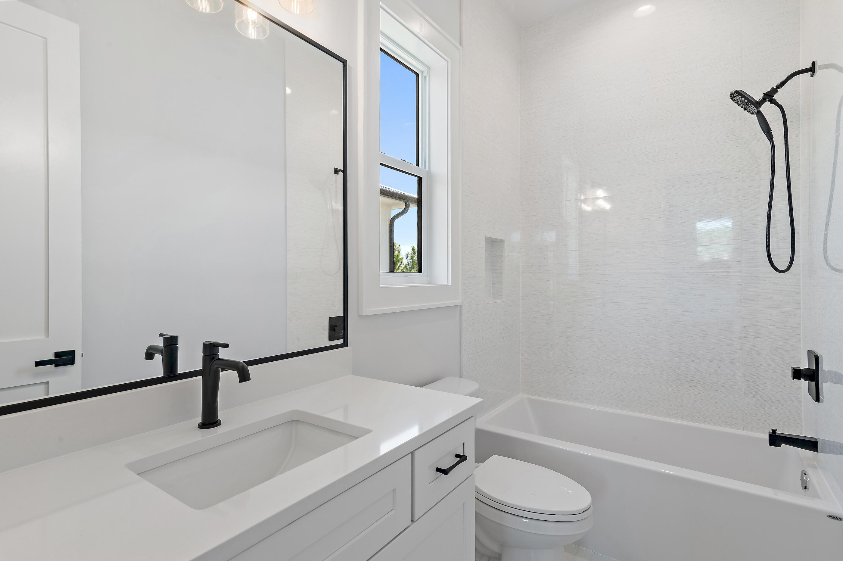 22 Henderson Place Santa Rosa Beach, FL 32459 - Photo 28 of 33 a bathroom with a sink a toilet and a tub