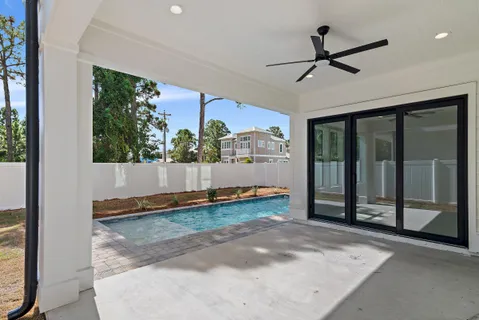 a view of a livingroom with a ceiling fan and window in a room