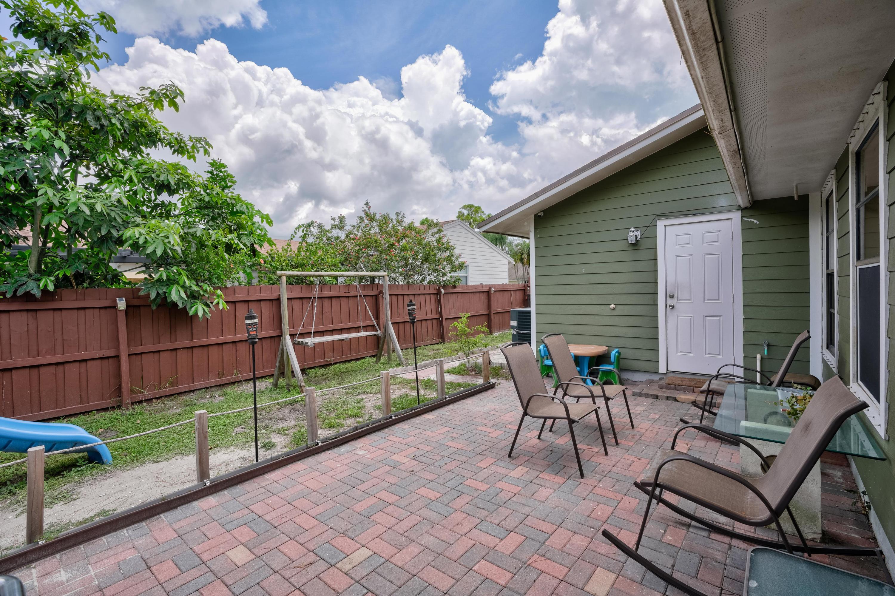 6120 Wolfe Street Jupiter, FL 33458 - Photo 26 of 55 A private patio that invites comfort