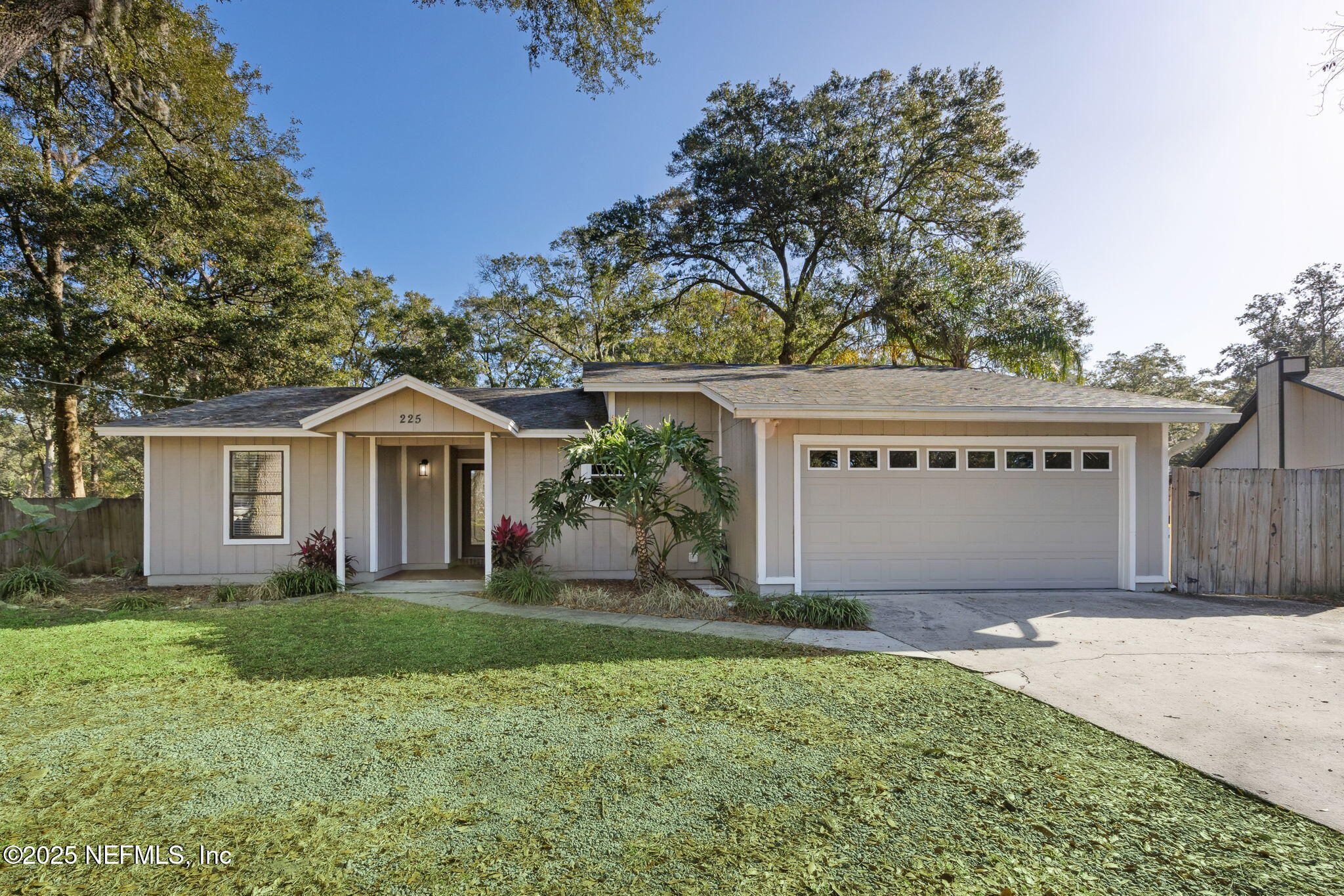 225 San Pablo Road North Jacksonville, FL 32225 - Photo 1 of 38 a front view of a house with a yard and garage