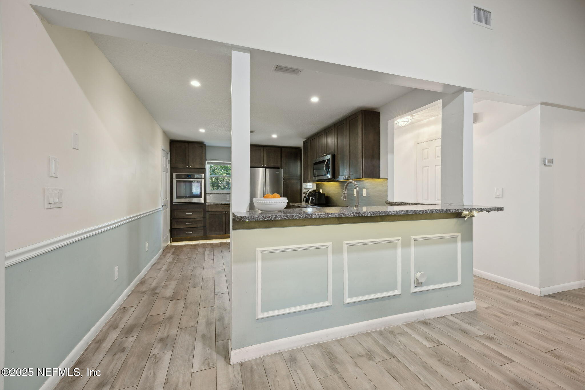 225 San Pablo Road North Jacksonville, FL 32225 - Photo 18 of 38 a large bathroom with a sink and a large mirror
