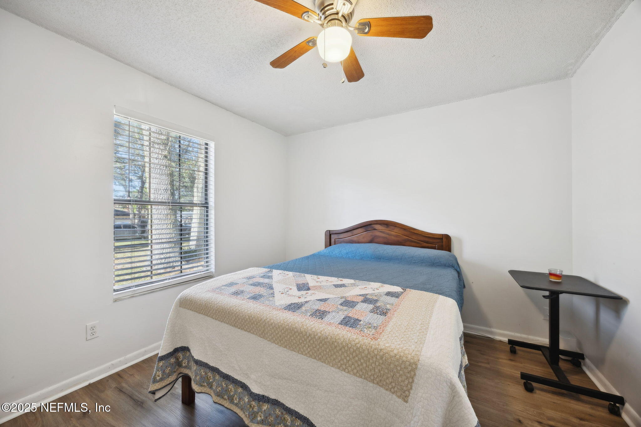 225 San Pablo Road North Jacksonville, FL 32225 - Photo 27 of 38 a bedroom with a bed and a chandelier