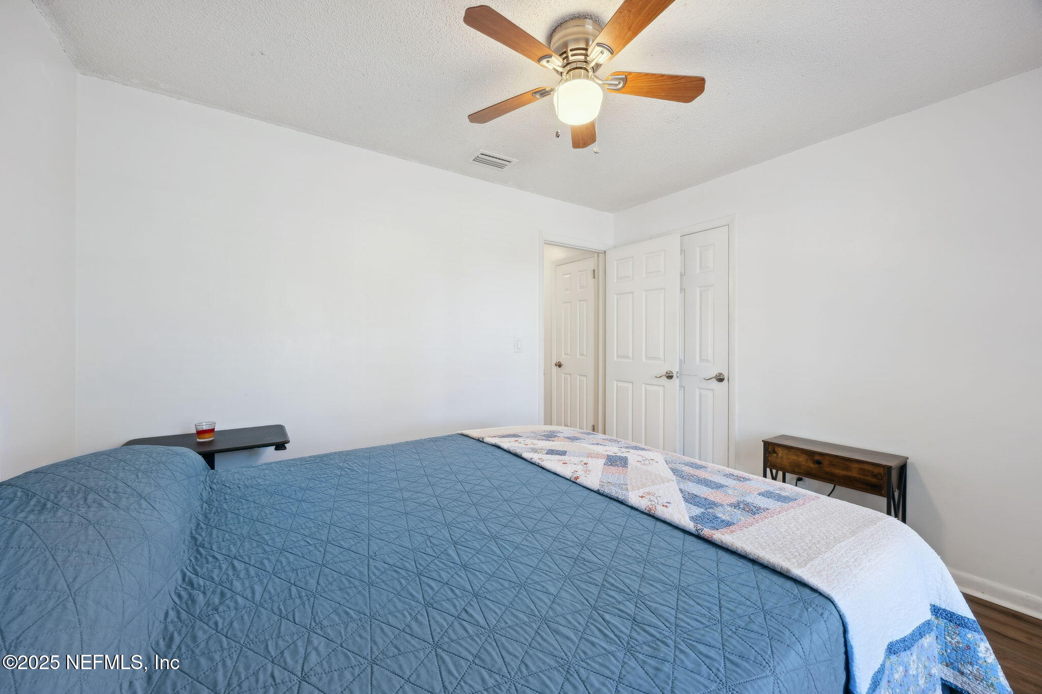225 San Pablo Road North Jacksonville, FL 32225 - Photo 28 of 38 a bedroom with a bed and a chandelier