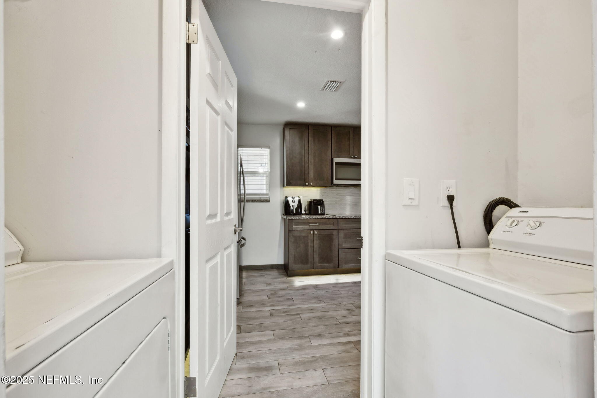 225 San Pablo Road North Jacksonville, FL 32225 - Photo 29 of 38 a kitchen with a refrigerator and a sink