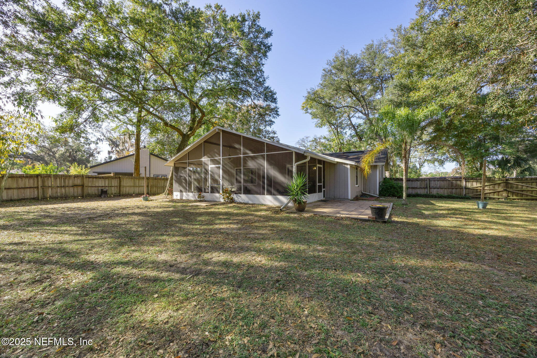 225 San Pablo Road North Jacksonville, FL 32225 - Photo 34 of 38 a view of a house with backyard and tree