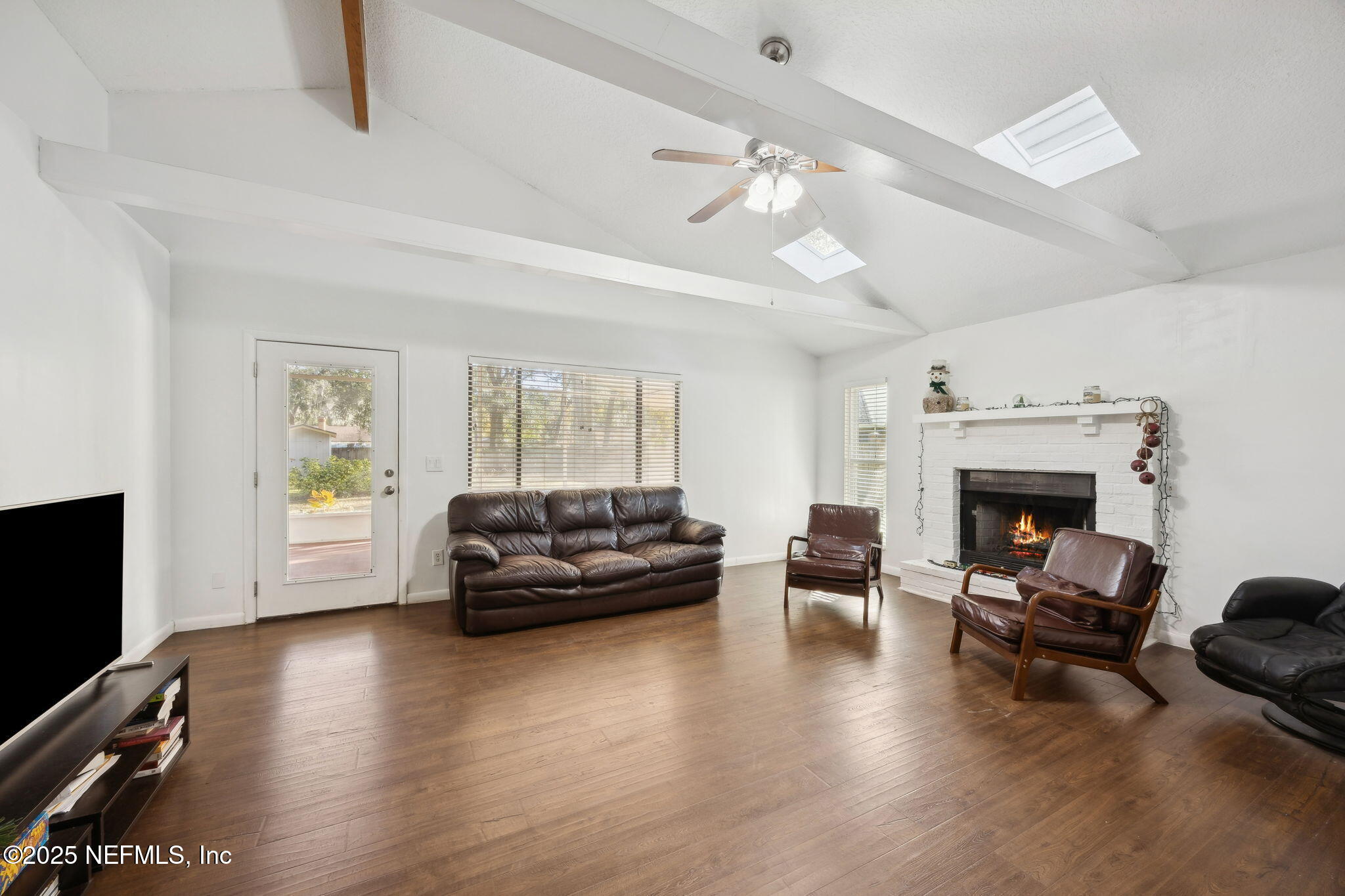 225 San Pablo Road North Jacksonville, FL 32225 - Photo 7 of 38 a living room with furniture and a fireplace