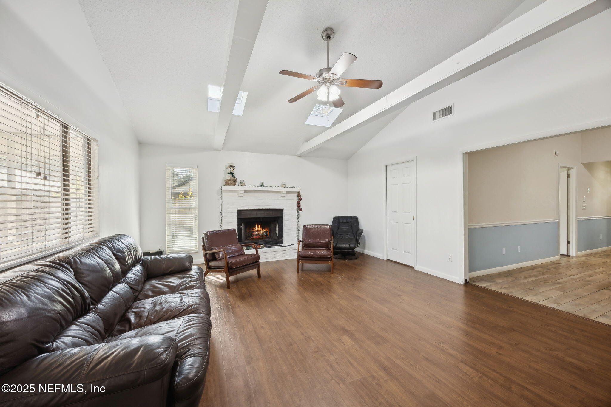 225 San Pablo Road North Jacksonville, FL 32225 - Photo 8 of 38 a living room with furniture and a fireplace