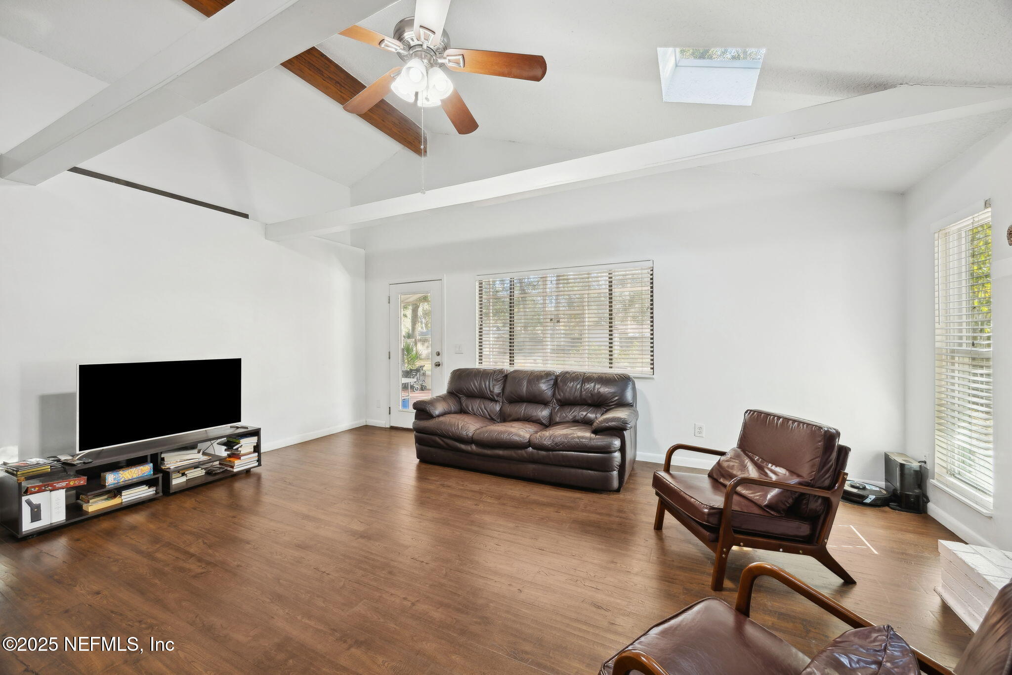 225 San Pablo Road North Jacksonville, FL 32225 - Photo 9 of 38 a living room with furniture and a flat screen tv