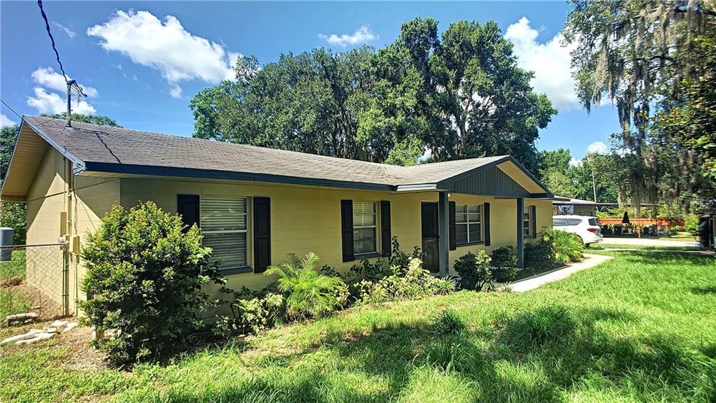 216 Larry Road Lakeland, FL 33809 - Photo 1 of 1 a front view of a house with garden