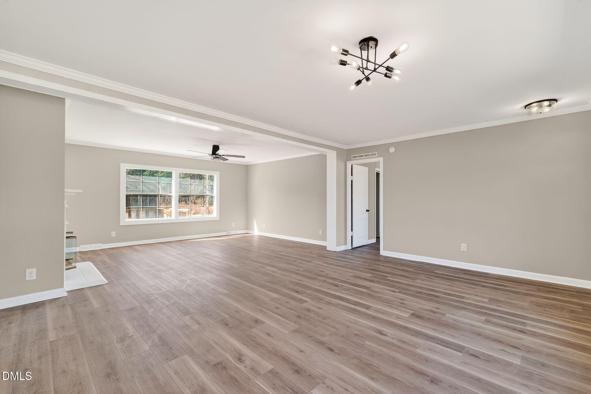 10015 Smith Road Middlesex, NC 27557 - Photo 8 of 48 a view of an empty room with wooden floor and a window