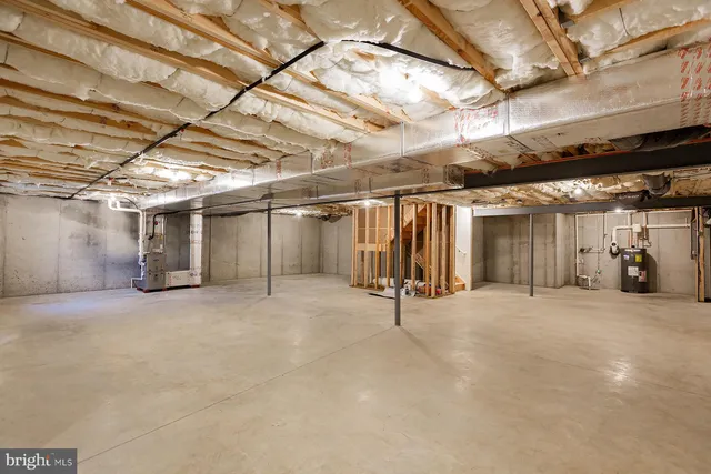a view of empty room with wooden ceiling