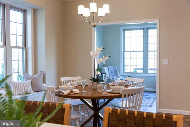 a view of a dining room with furniture and window