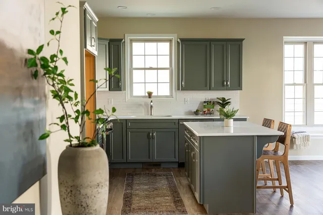 a kitchen with sink and window
