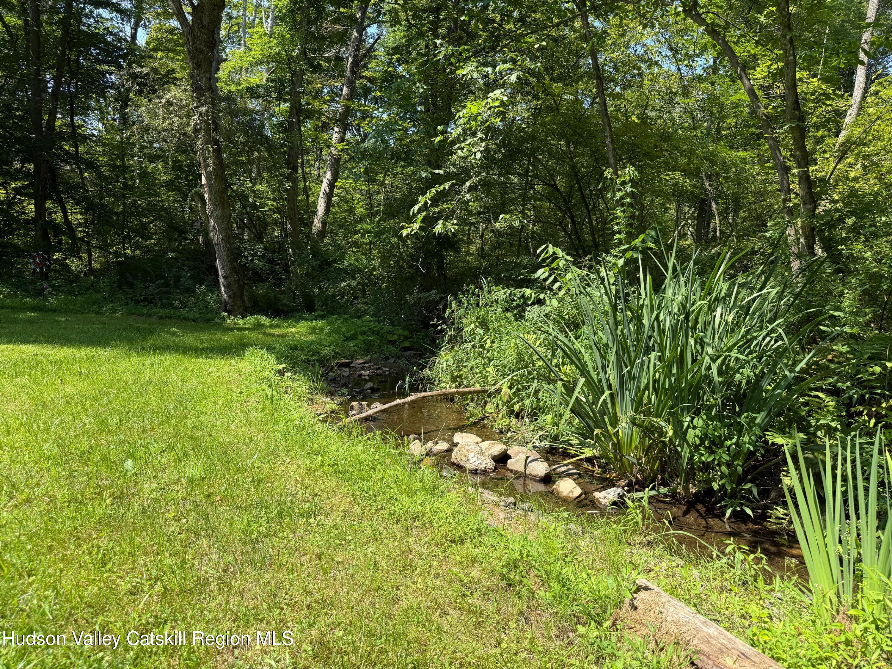 472 Doodletown Road Ancram, NY 12502 - Photo 20 of 23 a backyard of a house with lots of green space