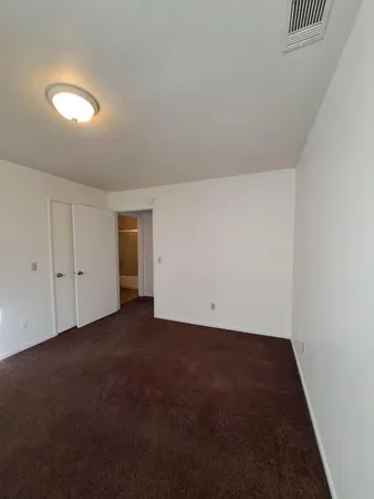a bathroom with a toilet a sink and shower