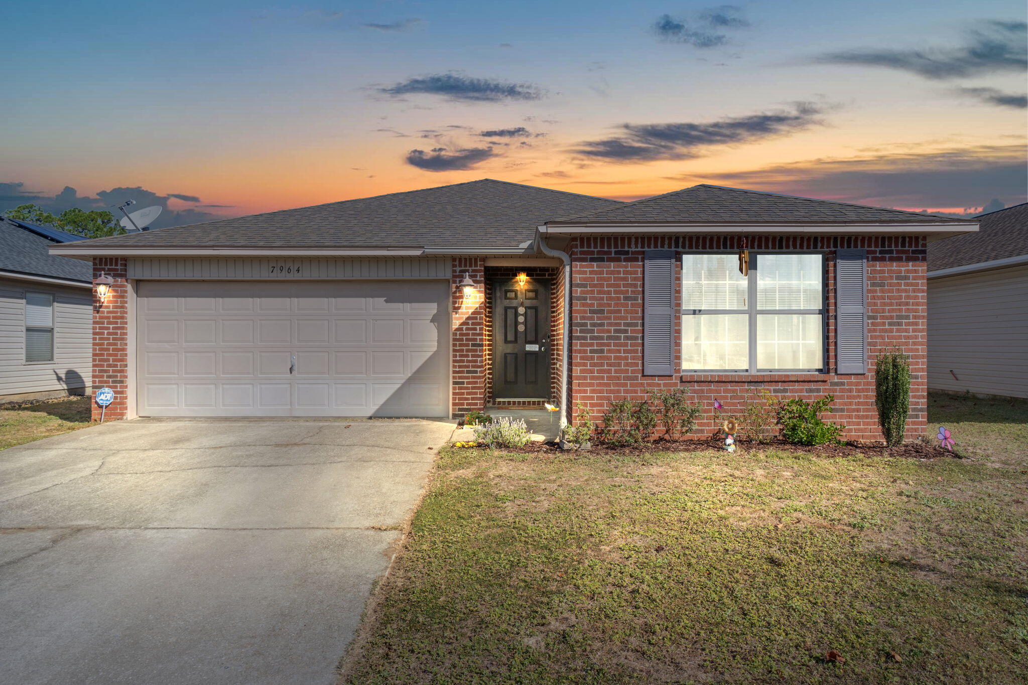 7964 Promise Creek Road Navarre, FL 32566 - Photo 1 of 43 a view of a house with a yard