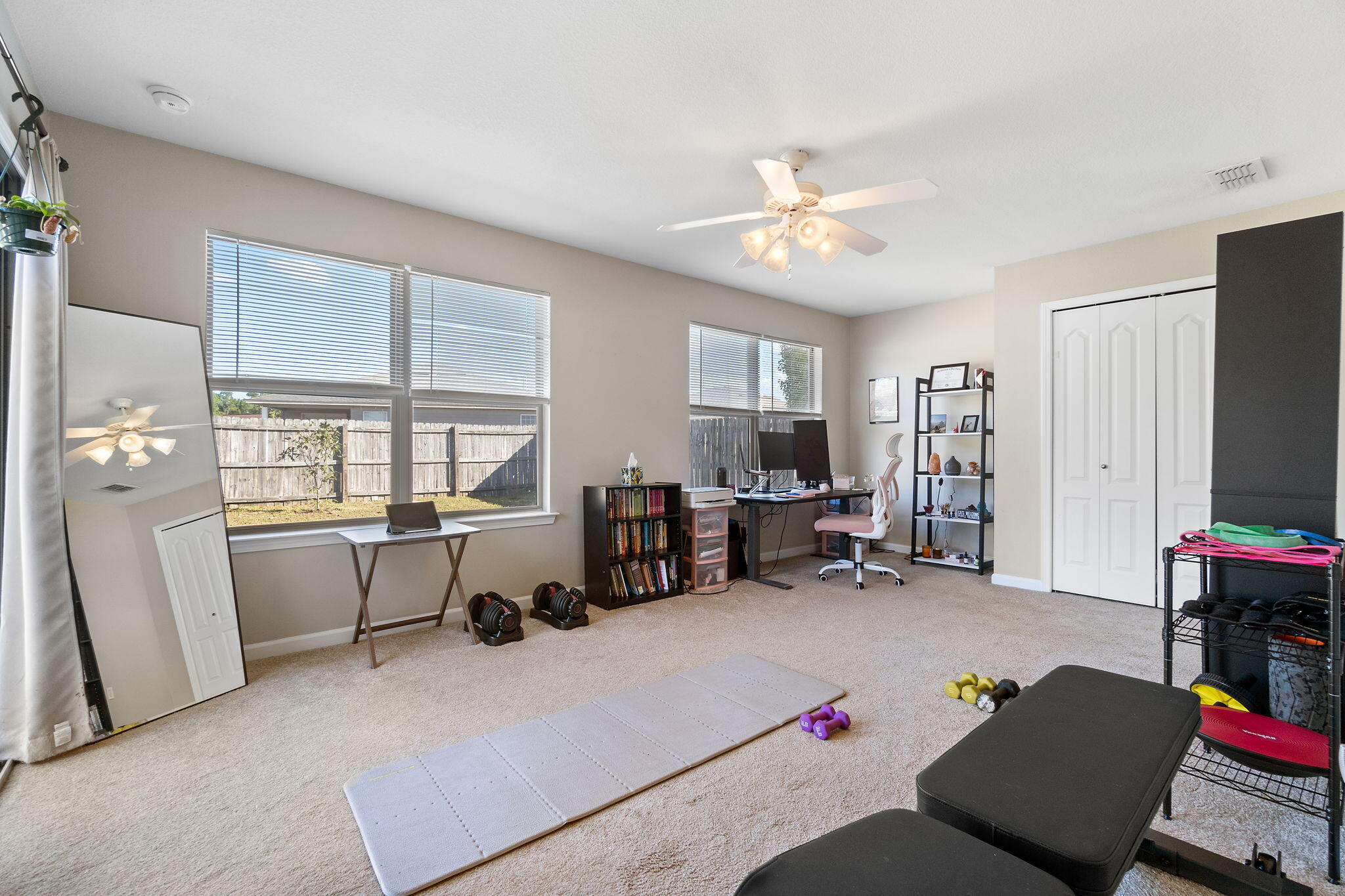 7964 Promise Creek Road Navarre, FL 32566 - Photo 31 of 43 a living room with furniture and a flat screen tv