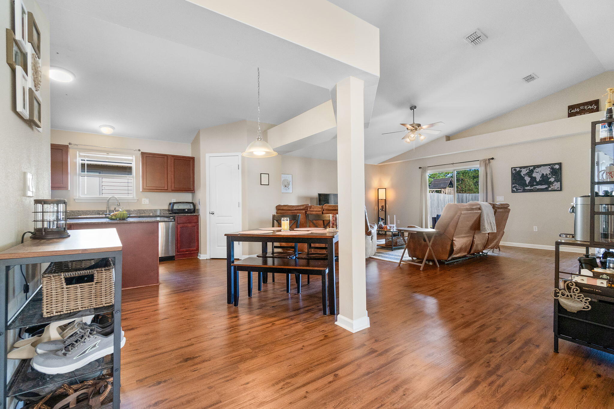 7964 Promise Creek Road Navarre, FL 32566 - Photo 5 of 43 a living room with furniture and a wooden floor
