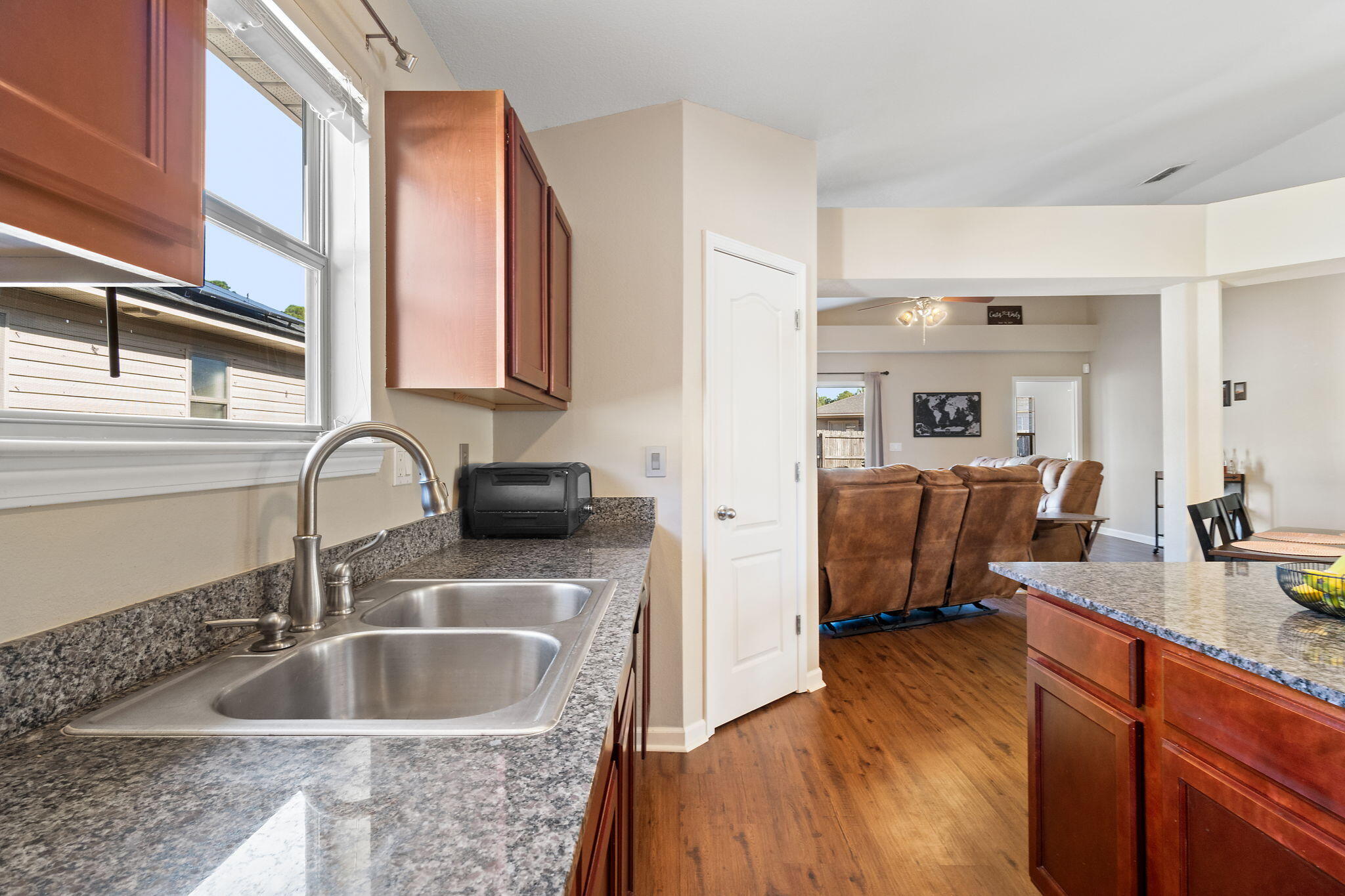 7964 Promise Creek Road Navarre, FL 32566 - Photo 9 of 43 a kitchen with a sink and a stove top oven
