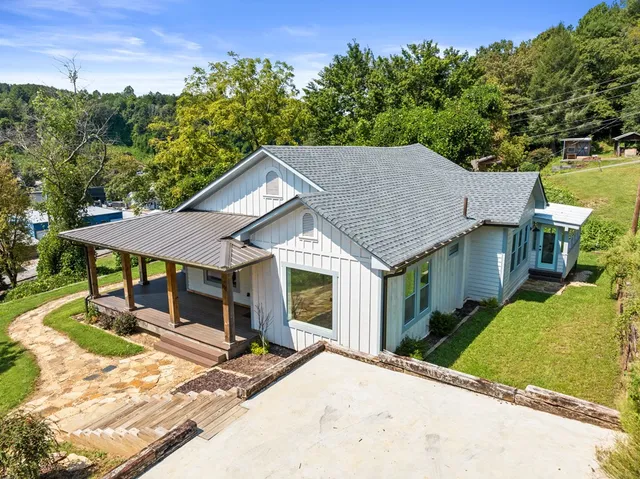 a house with trees in the background