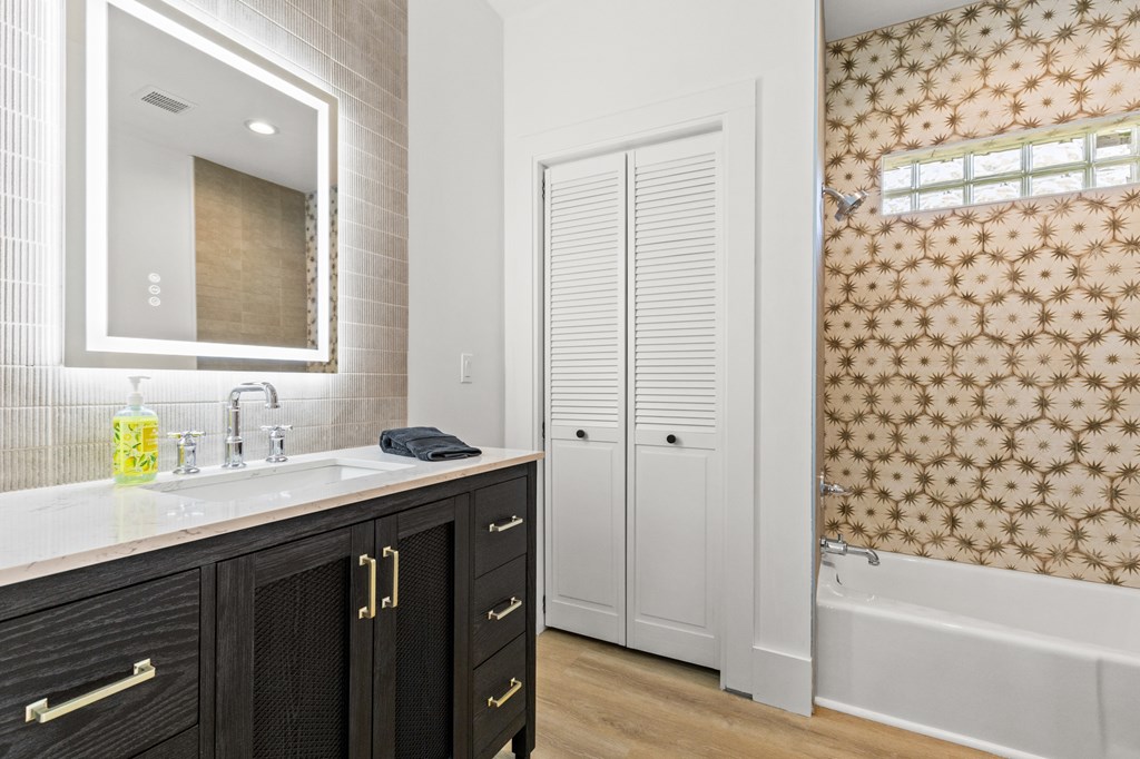 111 Highland Street Copperhill, TN 37317 - Photo 23 of 41 a bathroom with a granite countertop sink a toilet and shower