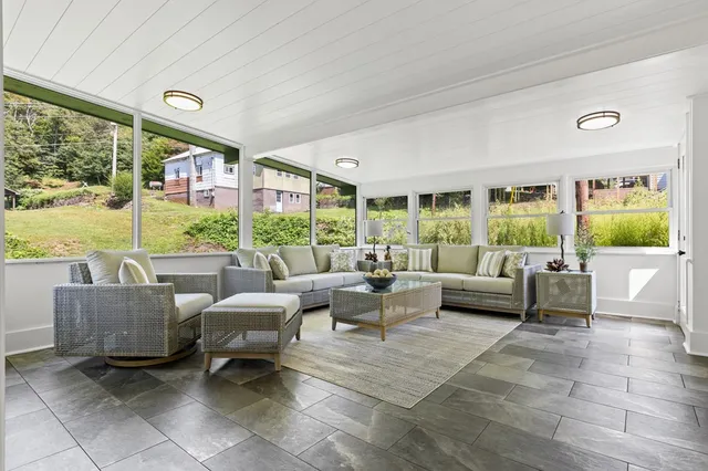 a living room with furniture and a large window