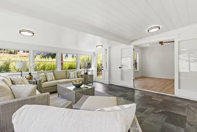 a living room with furniture and a large window